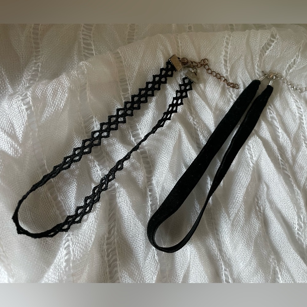 Black leather and ribbon Choker necklaces, one from Claire’s